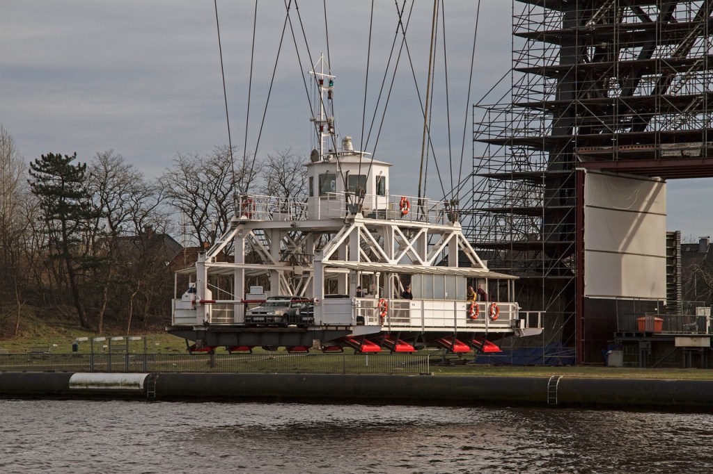 This picture shows a close up view of the vehicle transporter gondola suspended below the Rendsburg High Bridge bridge, 