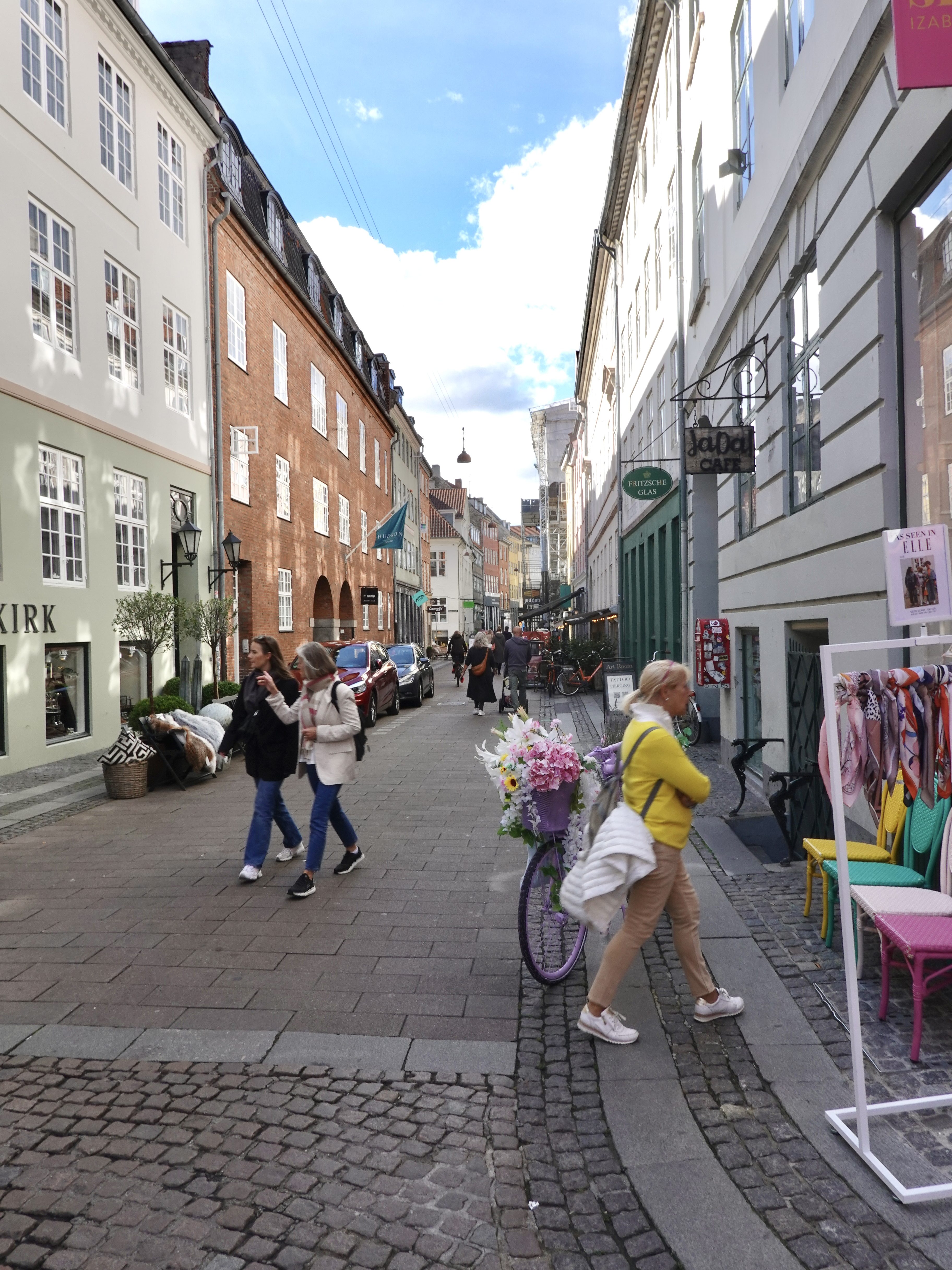 A view of a local cobble stoned
neighbourhood street in central Copenhagen showing a collection of local retail shops and eateries. This local street lies between Stroget and Gammel Strand. It can be visited as part of the self guided walking route highlighted in this post.