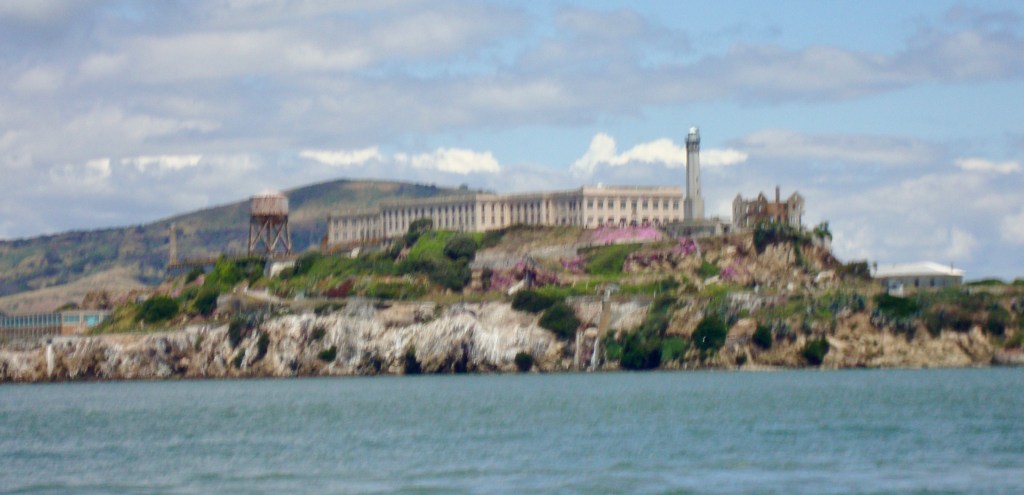 This image shows Alcatraz island and prison building, as seen from a Blue and Gold Fleet ferry travelling from Fisherman's Wharf to Sausalito Alcatraz Island is located in San Francisco Bay, California